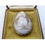 A 9ct mounted shell cameo brooch, finely carved with Lleda and the Swan. 60mm high