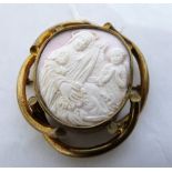 A Victorian coral brooch carved with the Madonna and the Christ child