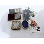 A silver faced photograph frame, another in white metal, early photograph and postcards