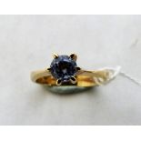 A 14ct blue topaz solitaire ring. 3.5g gross. Size O