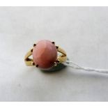 A pink opal ring. In gold marked 375. Size N