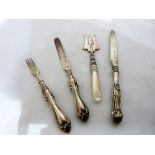 A silver and mother-of-pearl hafted pastry fork, a silver fork and two silver pastry knives