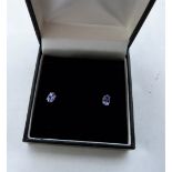 A pair of 9ct white gold tanzanite ear studs