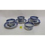A part set of 19th century French tea cups and saucers of fluted design decorated in chinoiserie