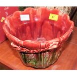 A Victorian Ault jardinière moulded with acanthus in shades of red and green. 7'' high