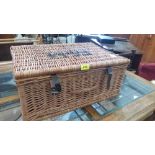 A Fortnum and Mason picnic hamper with picnic blankets