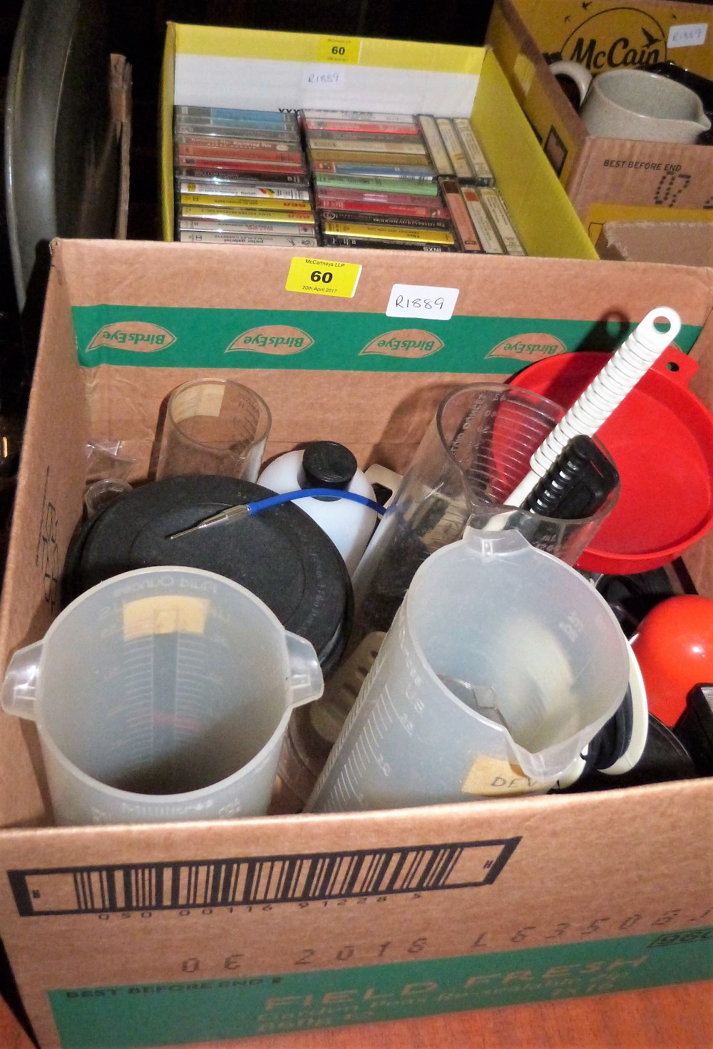 A box of cassette tapes and a box of darkroom equipment