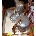 A Picquot Ware tea service comprising teapot, hot water jug, sucrier, milk jug and tray