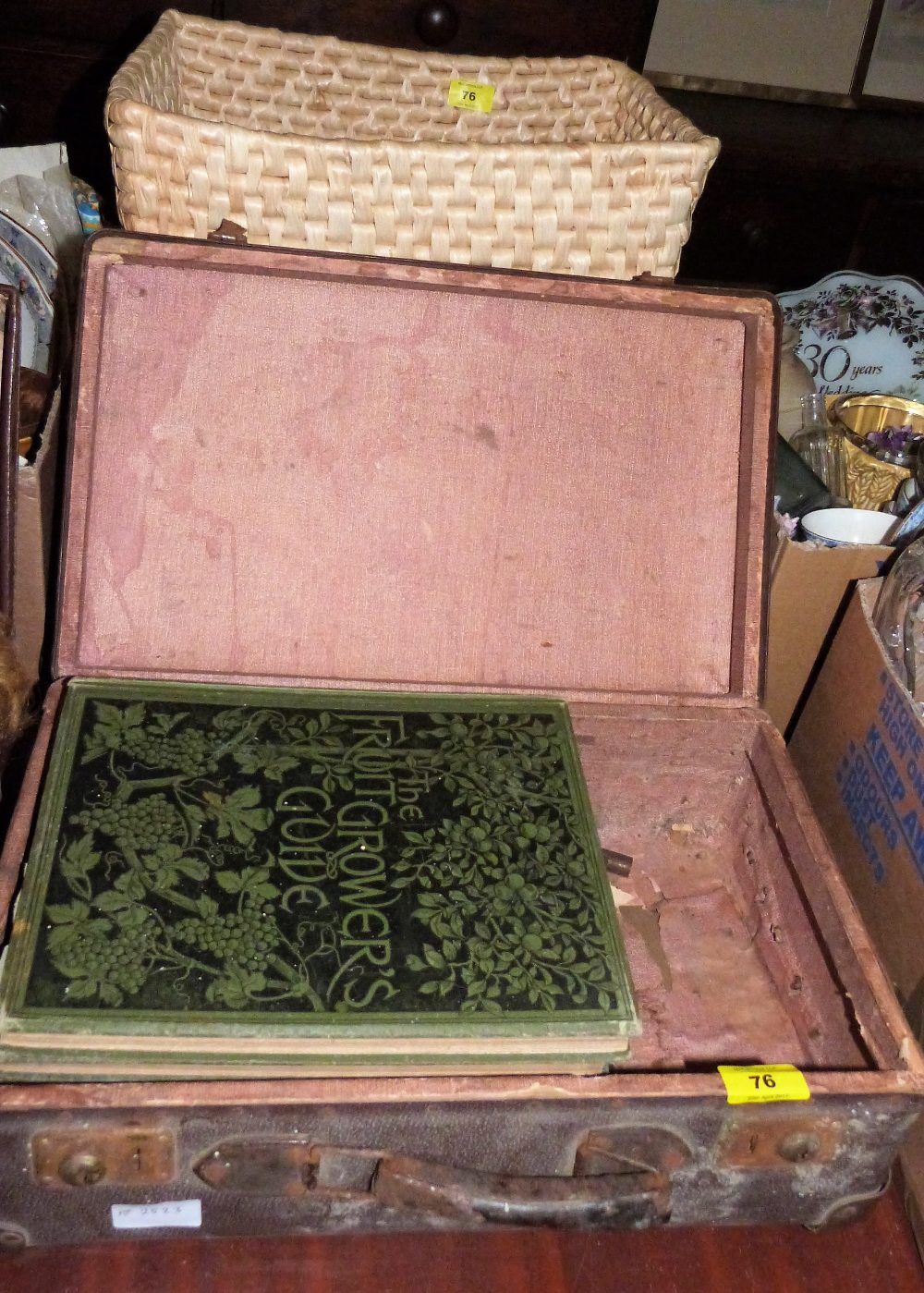 A picnic set, basket and six volumes of The Fruit Grower's Guide