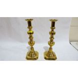 A pair of 19th century brass candlesticks. 14'' high