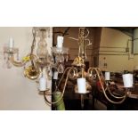 An eight light electrolier and a three light chandelier
