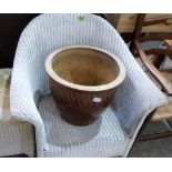 A loom armchair and a glazed garden pot