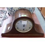 An oak mantle clock with triple train movement