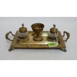 A 19th century French ormolu ink standish with two cut glass wells. 12¼'' wide over handles