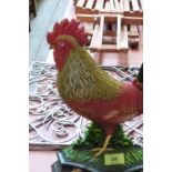 An iron cockerel doorstop