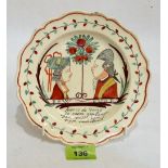 An 18th century creamware dish decorated to commemorate William of Orange. Probably Leeds pottery.