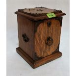 A Victorian oak and metal mounted smoker's cabinet, the interior with two tobacco pipes. 9'' high