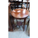 An Edward VII mahogany and inlaid two tier centre table. 20'' diameter