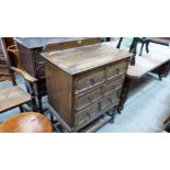 A pair of 1920's oak chests each with three long geometrically moulded drawers on barley twist legs.