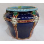 A Victorian majolica jardinière, probably Mintons, moulded with grotesque masks on a cobalt