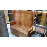 A pine box settle, the wing back with three fielded panels. 50'' wide