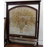 A late Victorian mahogany firescreen, the double sided banner with silkwork embroidered peafowl or