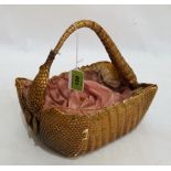 A taxidermy armadillo sewing basket. 9'' wide