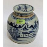 A Chinese pottery jar and cover, decorated in blue and white with a continuous land and seascape.