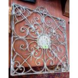 Two wrought metal decorative panels. 16'' wide