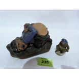 A Great War novelty pin cushion, moulded in cold painted plaster as a German soldier in a crouched