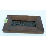 A carved oak panel in oak frame. 11'' wide overall