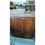 A mahogany cabinet enclosed by a pair of panel doors. 36'' wide