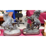 A pair of speltar rearing horse and figure groups. 17'' high