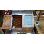 A late Victorian oak stationery cabinet, the pair of foliate panel sloping doors enclosing letter