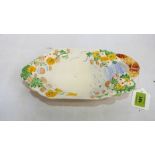 A Clarice Cliff nut dish relief decorated with flowers. 10'' wide