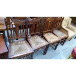 A set of four Edwardian walnut chairs with drop-in rush seats