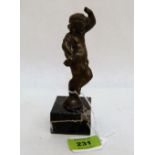 A 19th century bronze of a dancing child, raised on a marble socle. 6'' high