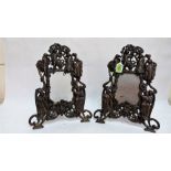 A pair of Victorian cast iron photograph frames with figure and scroll decoration. Bears reg. mark