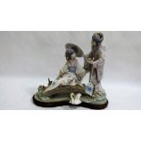 Lladro: A large and impressive group of oriental ladies on a bridge, one with a parasol, raised on a