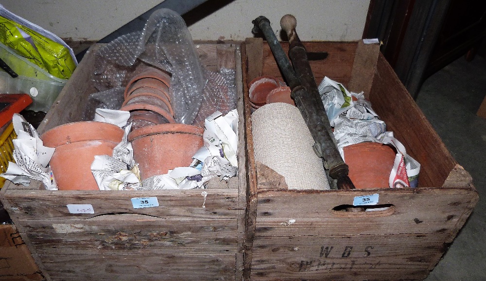 Two crates of terracotta garden pots