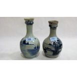 Two Chinese baluster vases decorated in blue and white with coastal landscapes. The taller 9'' high