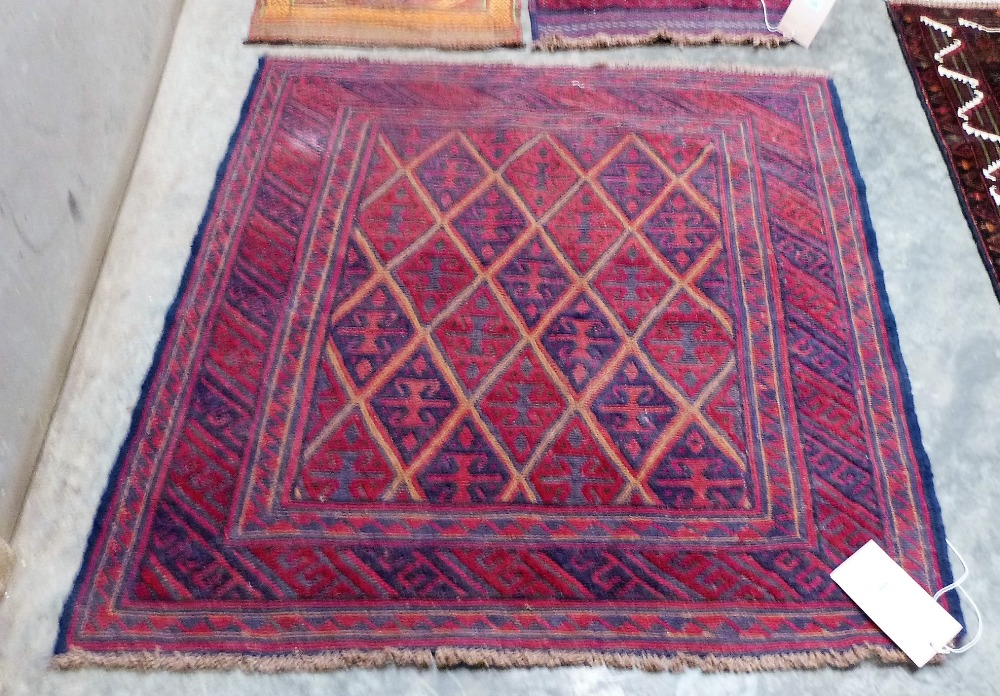 A tribal Gazak rug 117cm x 122cm