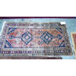 A red ground eastern rug 70'' x 36''