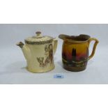 A decorated Royal Doulton teapot and a Royal Doulton jug decorated all round with a landscape.