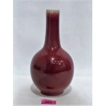 A Chinese bottle vase with sang-de-boeuf glaze. 9½'' high