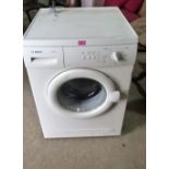 A Bosch Maxx5 washing machine finished in white enamel. Ex house clearance