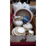 A box of dinnerware and a box of tea ware