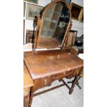 An oak dressing table with lancet swing plate. 36'' wide