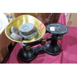 Cast iron weighing scales with weights and brass pan