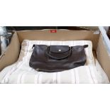 A Longchamp leather handbag and a cushion cover